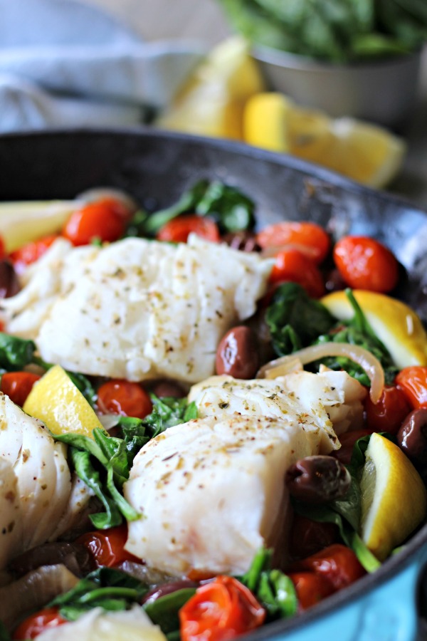 This Easy Greek Fish Skillet recipe has restaurant worthy flavor yet is simple enough to make on a busy weeknight! It's a one pan, healthy meal that's Paleo, Whole30 and Gluten Free.